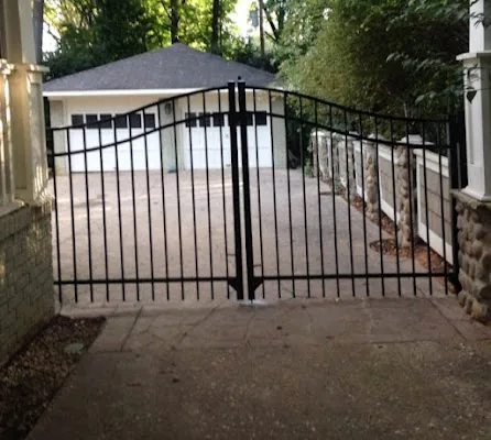 Black aluminum arched driveway gate — Timber Fencing, Monroe, NC